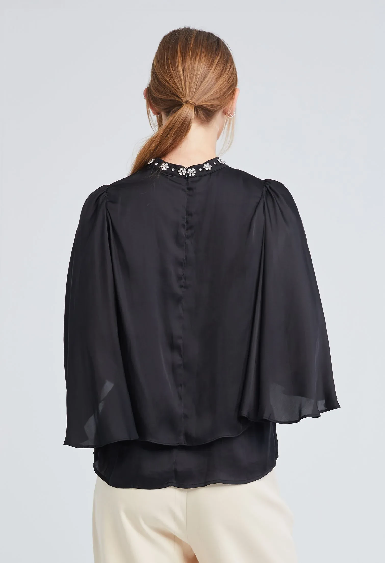 EMBELLISHED CAPE HIGH NECK BLOUSE [BLACK]