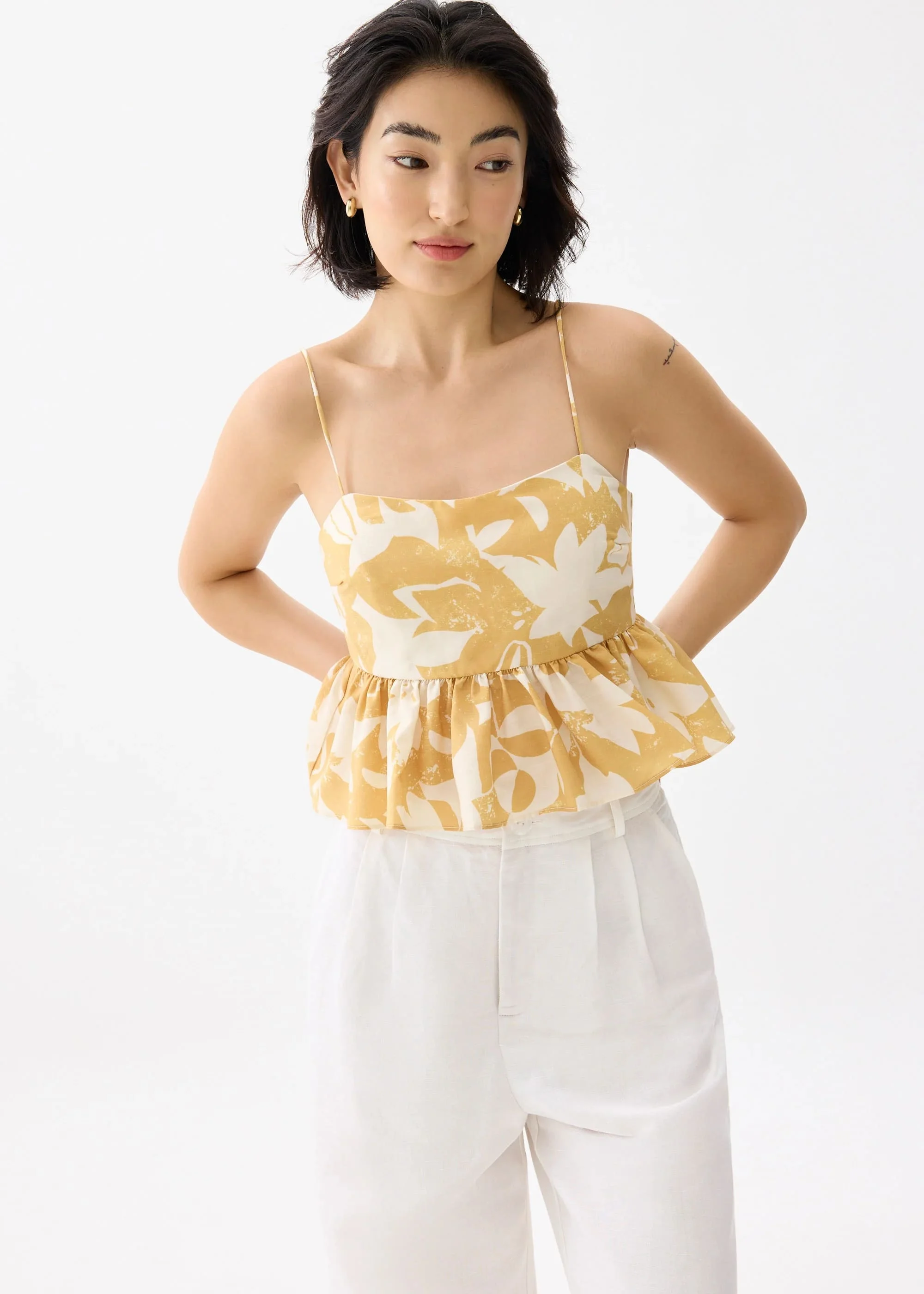 PADDED BABYDOLL PEPLUM TOP IN SUNBURST - GOLD